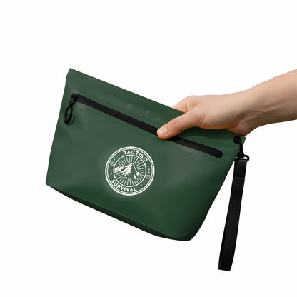 Hand holding green waterproof pouch